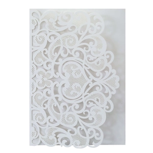 Detailed laser-cut heart pattern on elegant white bridal invitation cover with lace design
