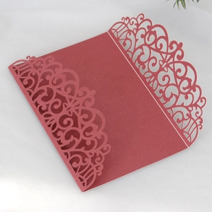 Intricate laser-cut burgundy pearl paper wedding invitation pocket with floral patterns
