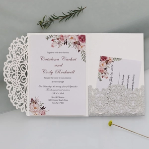 Laser cut floral wedding invitation suite with white lace sleeve and pink floral insert