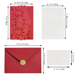 Detail of red laser cut lace wedding invitation set with envelopes and gold seals