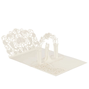 Detailed laser-cut 3D pop-up wedding invitation featuring a romantic couple and floral arch