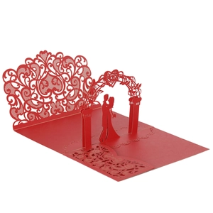 3D laser-cut wedding invitation featuring a red heart floral arch and a couple silhouette