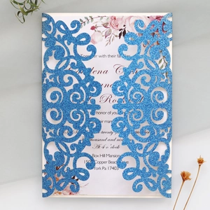 Detailed laser-cut glitter blue wedding invitation with elegant floral inner card