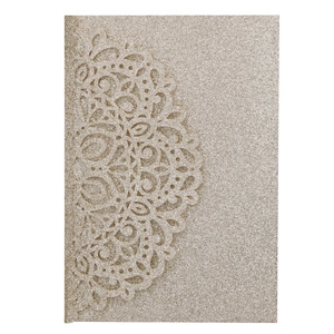 Laser cut champagne gold glitter invitation card featuring elegant mandala patterns
