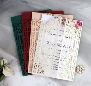 Detailed laser-cut gate wedding invitations in multiple colors with floral inner cards