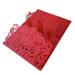 Red 3D laser cut wedding invitation card featuring hollow floral patterns and romantic silhouette