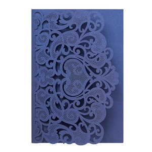 Macro view of navy blue laser-cut heart invitation card made of premium pearlescent paper