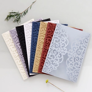 Macro view of laser-cut wedding invitation covers in seven pearlescent vintage colors