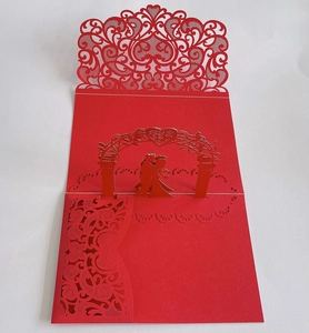 Detail of red laser-cut 3D wedding card with 3D pop-up bride and groom silhouette