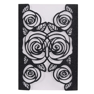 Close-up of black glitter rose laser-cut hollow pattern on wedding invitation card