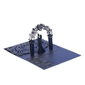 Detail of 3D laser-cut wedding card showing a couple under a navy blue hollow heart arch