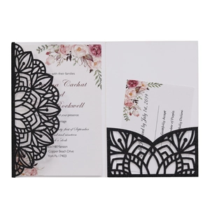 Elegant laser-cut black glitter wedding invitation set with floral patterns and RSVP card