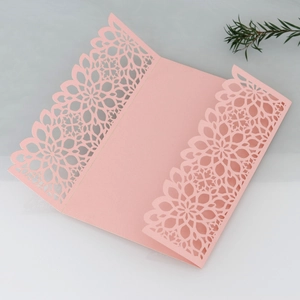 Elegant laser-cut pink wedding invitation card cover with intricate floral geometric patterns