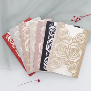 Detailed laser cut rose patterns on glitter paper wedding invitations in multiple colors