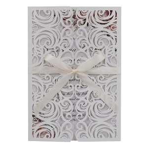 Detailed laser cut butterfly wedding invitation with elegant white ribbon and floral insert