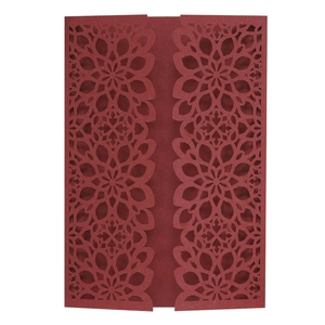Detailed laser-cut dark red wedding invitation cover with elegant floral patterns