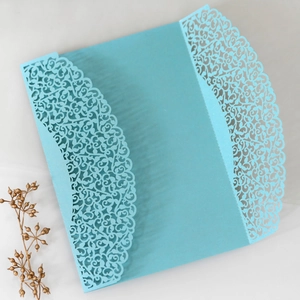 Laser-cut Tiffany blue invitation holder with intricate lace floral pattern details