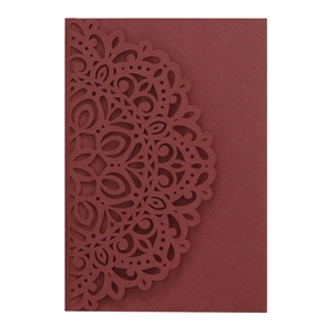 Detailed laser-cut mandala pattern on wine red pearl paper wedding invitation card