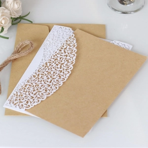 Laser cut lace wedding invitation with kraft envelope and white floral pattern cover