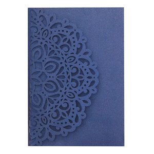 Detailed laser-cut mandala floral pattern on navy blue pearlescent invitation card