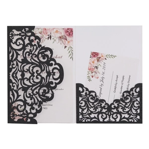 Black laser-cut wedding invitation set with glitter finish and pink floral watercolor inserts