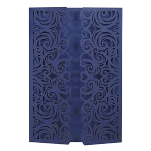 Detail of laser-cut navy blue wedding invitation with intricate floral hollow pattern