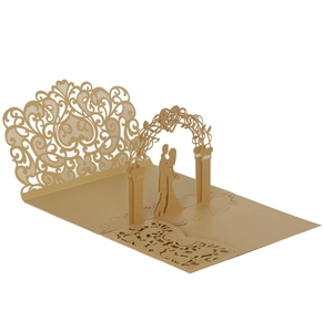 Detailed laser-cut 3D pop-up wedding invitation featuring a couple and floral archway