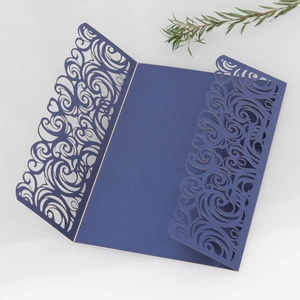 Elegant navy blue laser cut wedding invitation cover with intricate scroll patterns