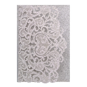 Detailed laser-cut silver glitter wedding invitation with intricate floral lace patterns