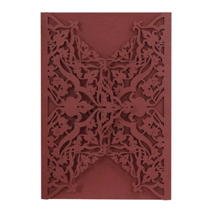 Elegant burgundy laser-cut floral wedding invitation card cover with intricate hollow design