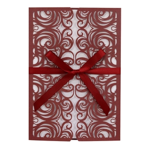 Dark red laser-cut butterfly wedding invitation with elegant ribbon and white insert