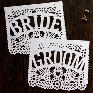 Mexican style wedding banners featuring white cutout Groom and Bride floral rose designs