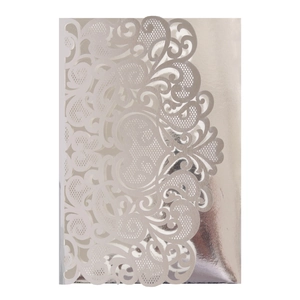 Detailed laser-cut pattern on silver pearlescent cardstock wedding invitation cover