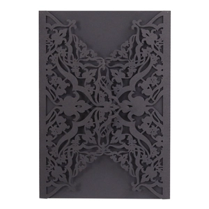 Elegant black laser-cut wedding invitation cover with intricate floral hollow pattern