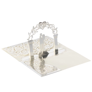 Detail of 3D laser-cut wedding card showing a couple kissing under a floral archway