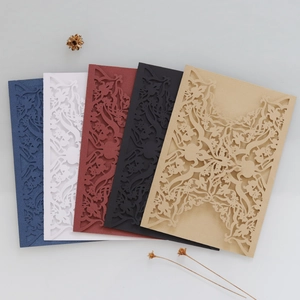 Laser-cut wedding invitations with intricate floral vine patterns in five premium colors