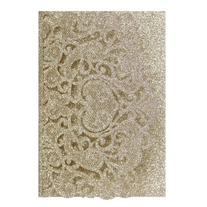 Macro detail of champagne gold laser-cut lace wedding invitation with glitter texture