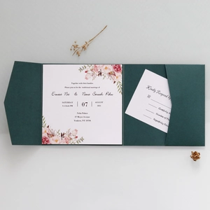 Detail view of dark green wedding invitation set with floral border and RSVP card