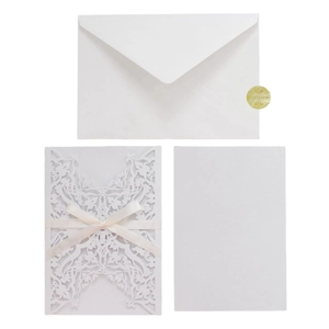 Laser cut champagne wedding invitation set with silk bow and gold seal sticker