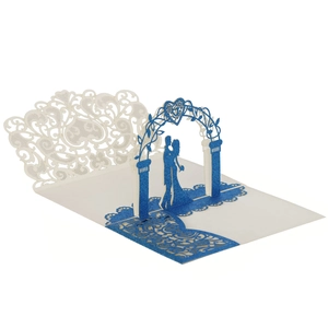 Macro shot of 3D wedding invitation with laser cut heart arch and blue glitter finish