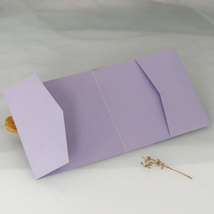 Detailed view of lavender tri-fold laser-cut invitation pocket with pearlescent finish