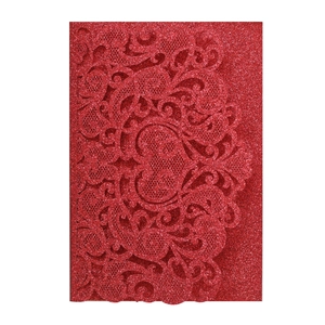 Detailed laser-cut lace pattern on red glitter wedding invitation with shimmering finish