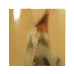 Close-up of a square metallic gold envelope with a triangular flap and reflective foil finish