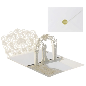 Detail of 3D laser cut wedding invitation with glitter accents and gold seal envelope