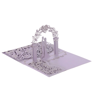 Detail of 3D pop-up wedding card featuring laser-cut lavender couple under heart arch