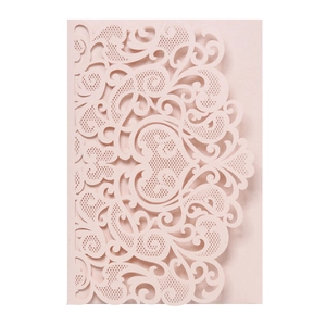 Detail of laser-cut floral pattern on light pink pearlescent paper invitation cover