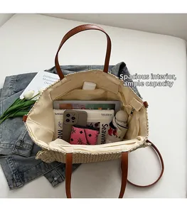 Top view of straw tote bag interior showing large capacity with phone and umbrella