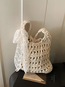 Handmade woven crochet bucket bag in cream white with lace ribbon and drawstring liner
