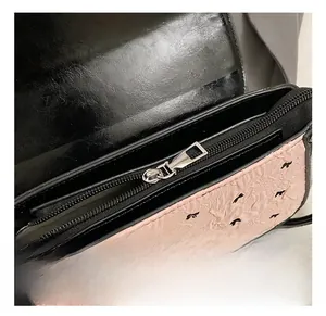 Macro detail of the high-quality metal zipper and magnetic snap on a pink bow handbag