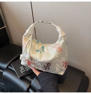 Close-up of the traditional Chinese embroidery on the fabric of this stylish hobo bag